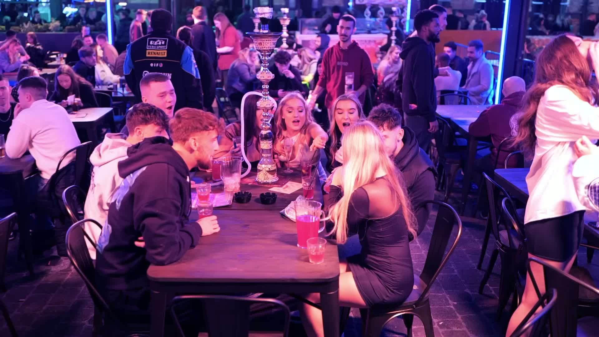 A group celebrating in a SOHO booth