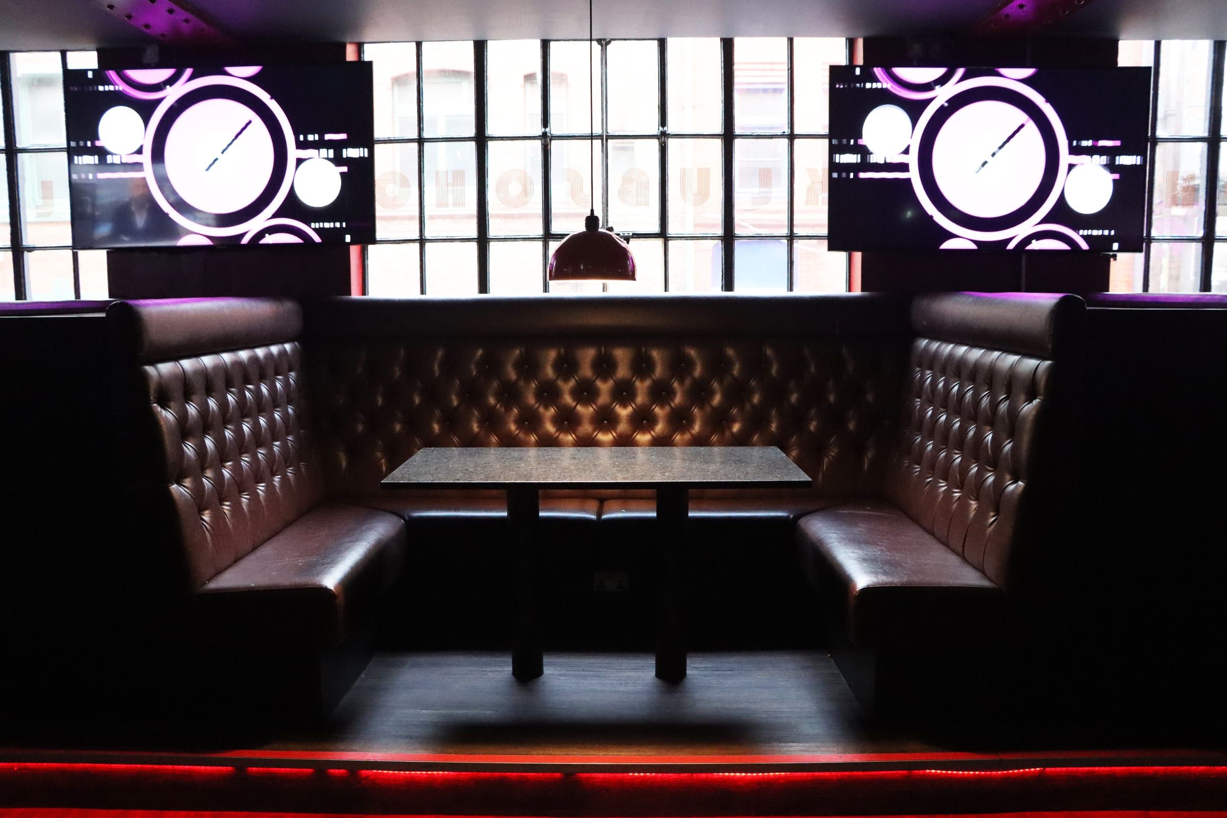 Leather booths under the screens at SOHO